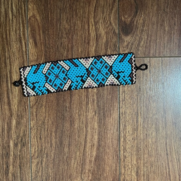 Beaded style white blue, and move and black bracelet. - Picture 2 of 2